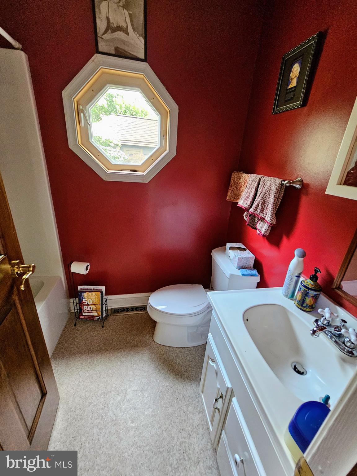 35 Read Street Seaford, DE 19973 - Photo 17 of 21 a bathroom with a sink mirror and toilet
