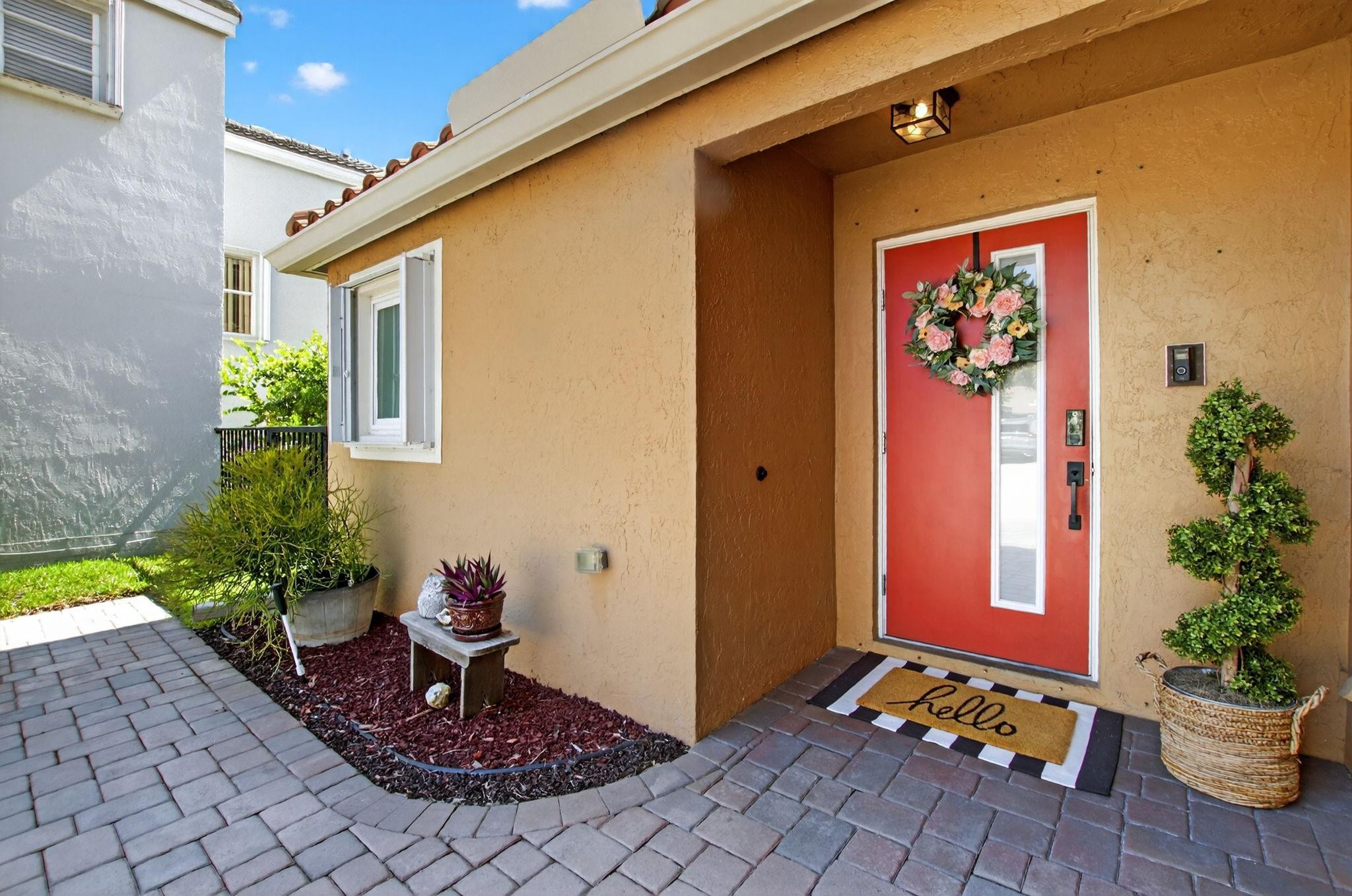 22271 Festival Way Boca Raton, FL 33428 - Photo 6 of 62 a front view of a house with a yard