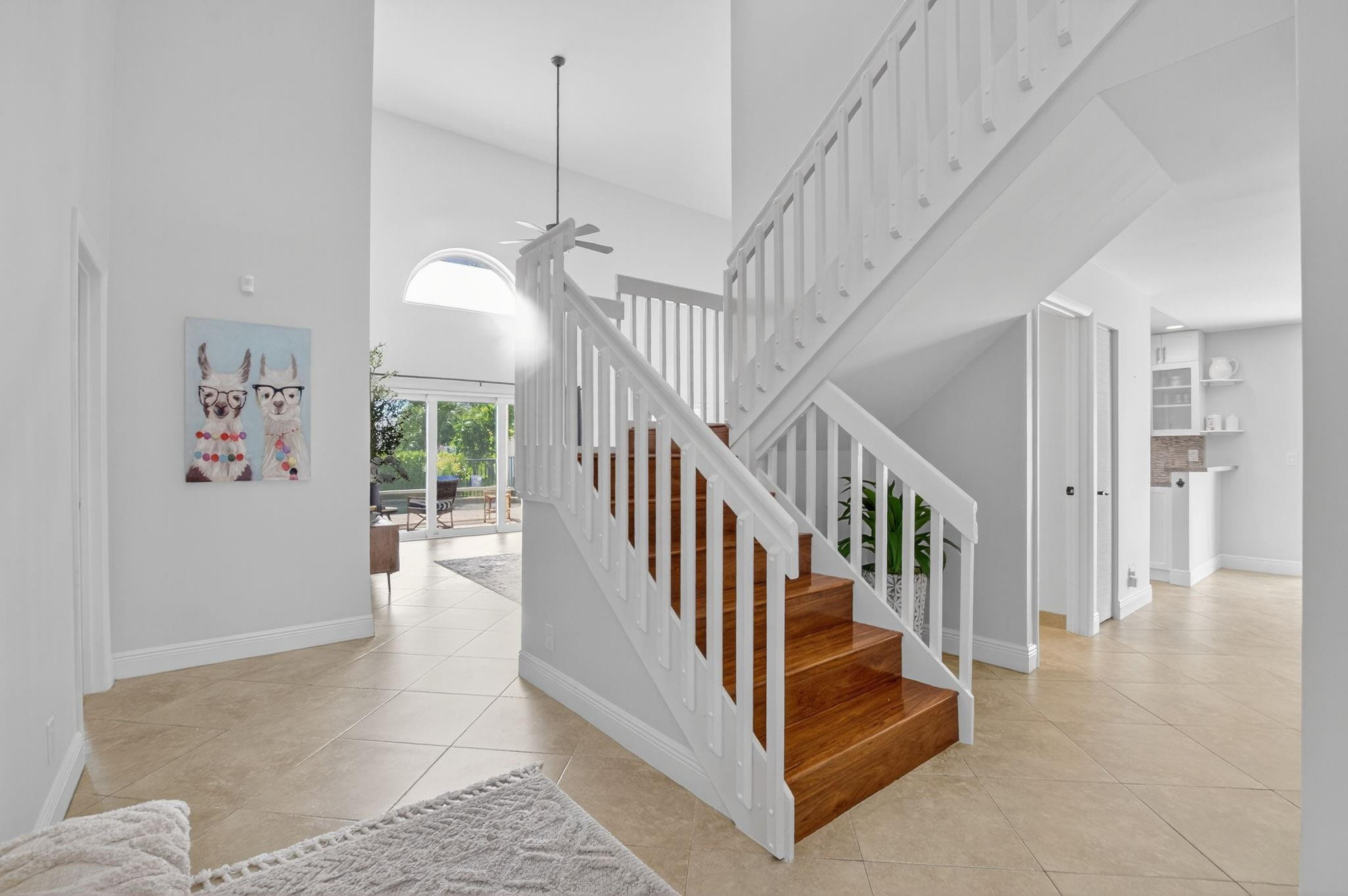 22271 Festival Way Boca Raton, FL 33428 - Photo 8 of 62 a view of staircase with lots of frames and a rug