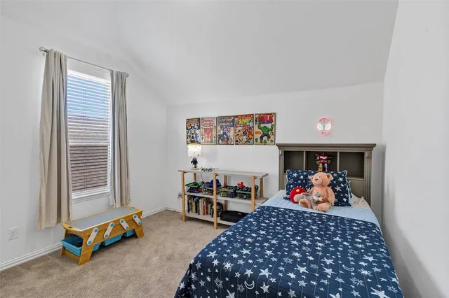 a bed room with a bed and a window