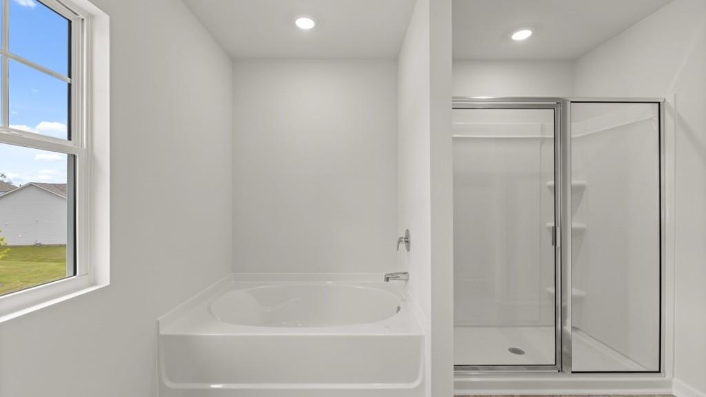 174 Thompson Ridge Lane Dallas, GA 30132 - Photo 21 of 35 a bathroom with a bathtub