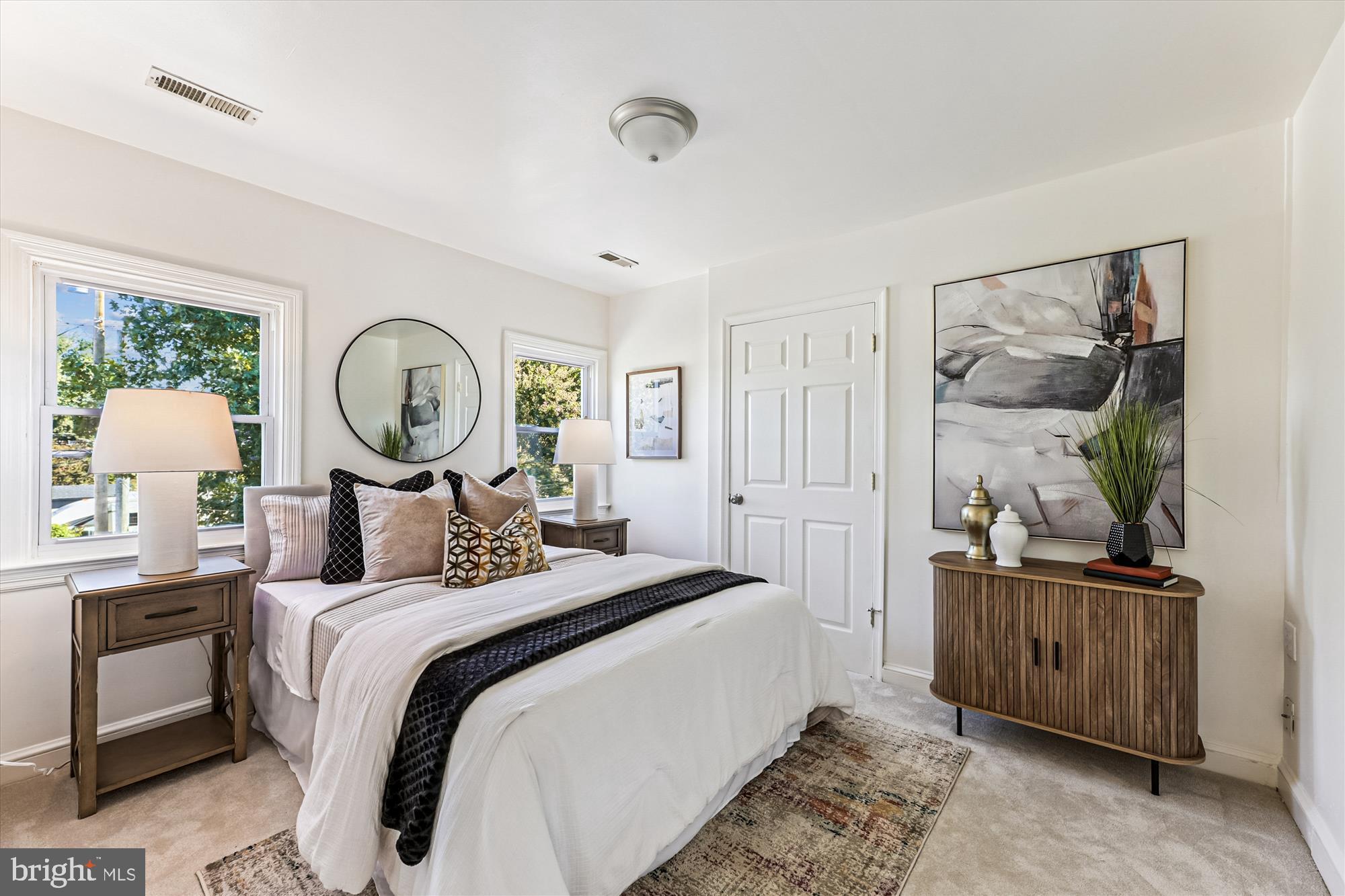 4225 Meade Street Northeast Washington, DC 20019 - Photo 13 of 46 Serene bedroom with natural light and style.