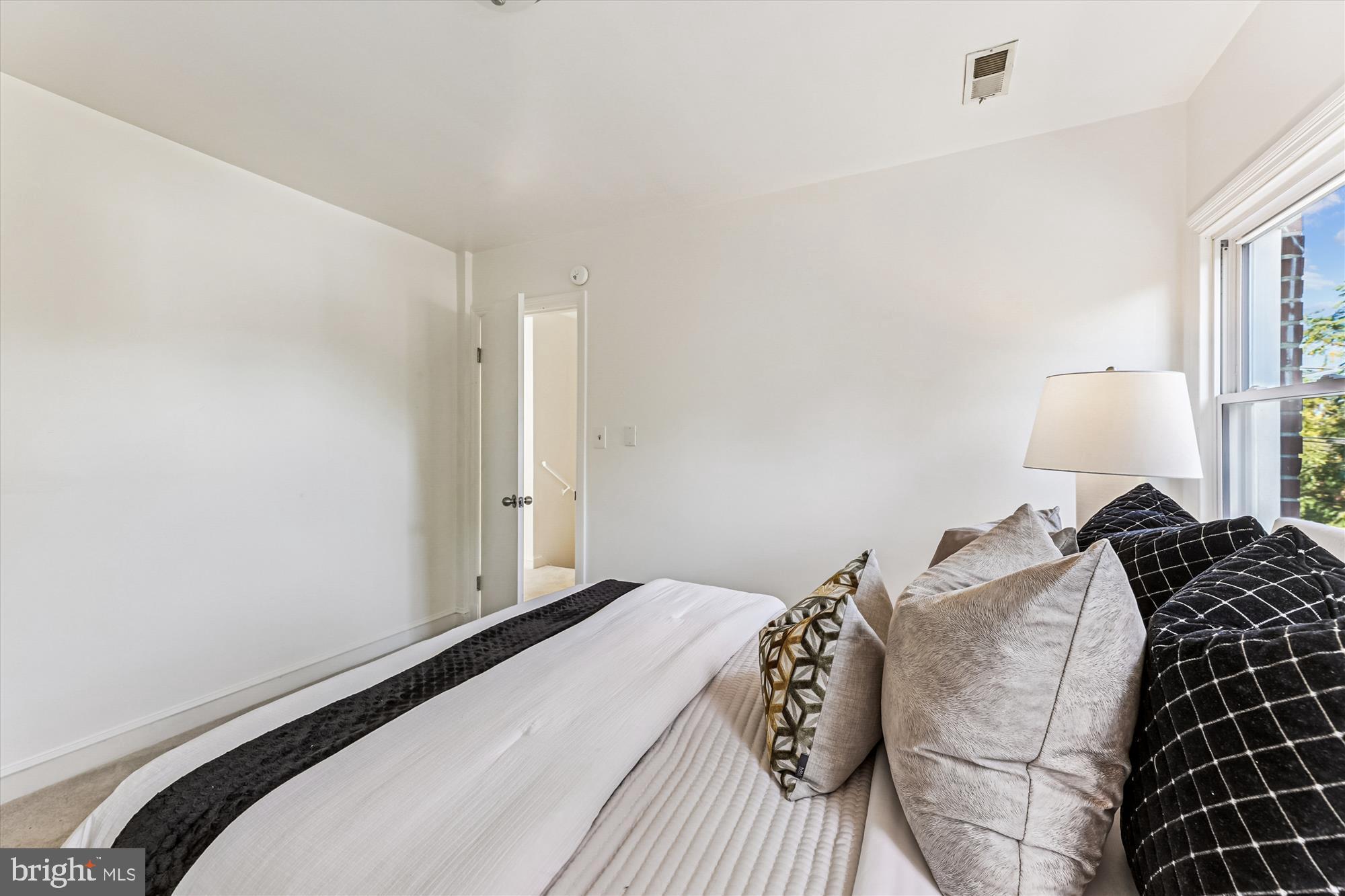 4225 Meade Street Northeast Washington, DC 20019 - Photo 14 of 46 Serene bedroom with natural light.