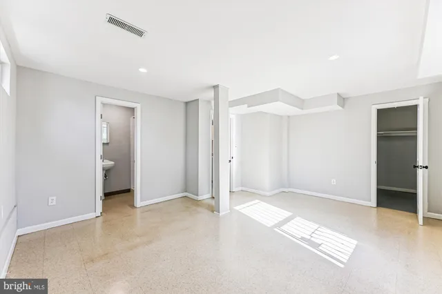 a bathroom with a sink toilet and a mirror
