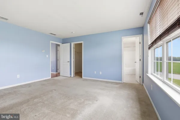 a view of an empty room with a large window