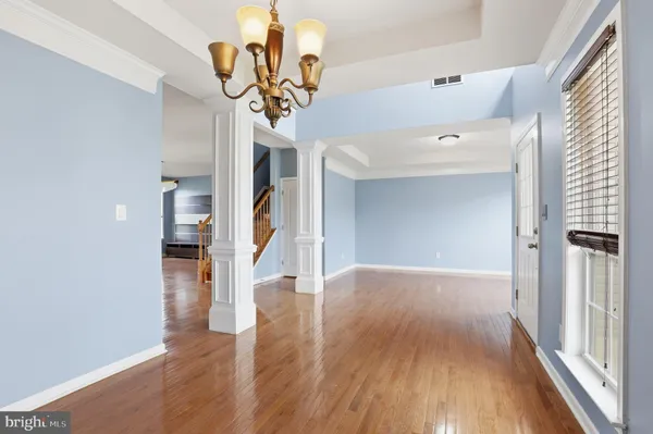 a view of entryway with wooden floor