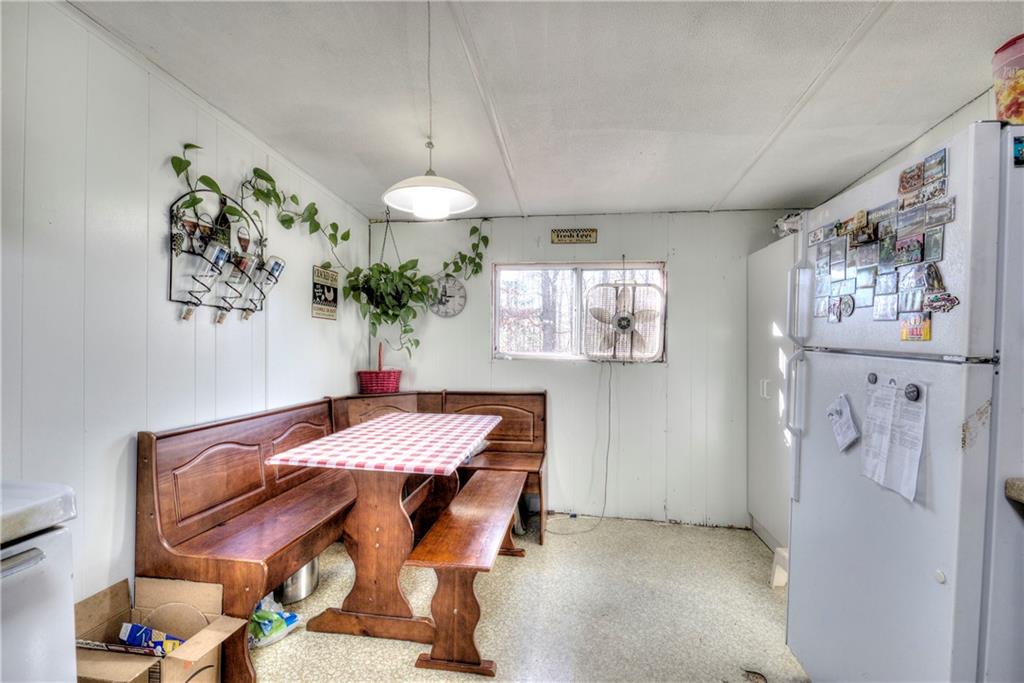 368 Pleasant Valley Road Northwest Adairsville, GA 30103 - Photo 20 of 31 a view of a dining room with furniture and chandelier