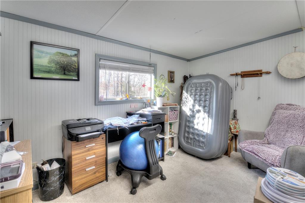 368 Pleasant Valley Road Northwest Adairsville, GA 30103 - Photo 25 of 31 a view of a workspace with furniture and a window