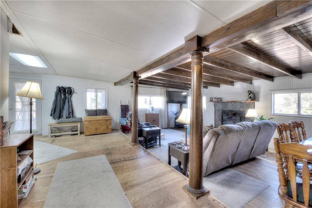 368 Pleasant Valley Road Northwest Adairsville, GA 30103 - Photo 29 of 31 a living room with furniture and a flat screen tv