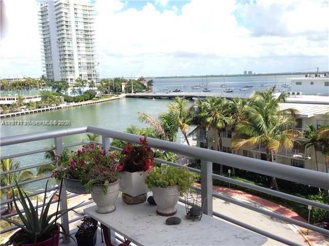 1450 Lincoln Road, Unit 604 Miami Beach, FL 33139 - Photo 2 of 16 a view of a balcony with lake view and a potted plant