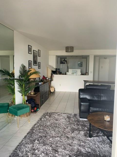 1450 Lincoln Road, Unit 604 Miami Beach, FL 33139 - Photo 9 of 16 a living room with furniture and a fireplace