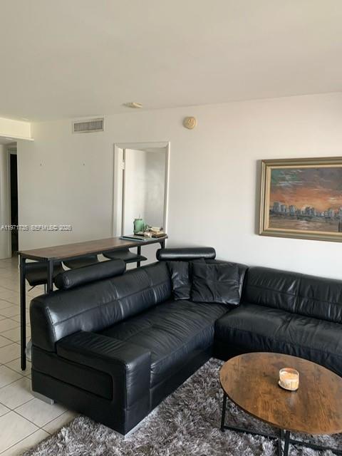1450 Lincoln Road, Unit 604 Miami Beach, FL 33139 - Photo 10 of 16 a living room with a couch