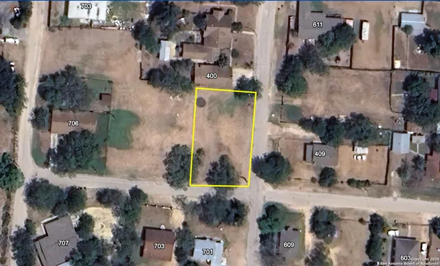 an aerial view of houses with outdoor space