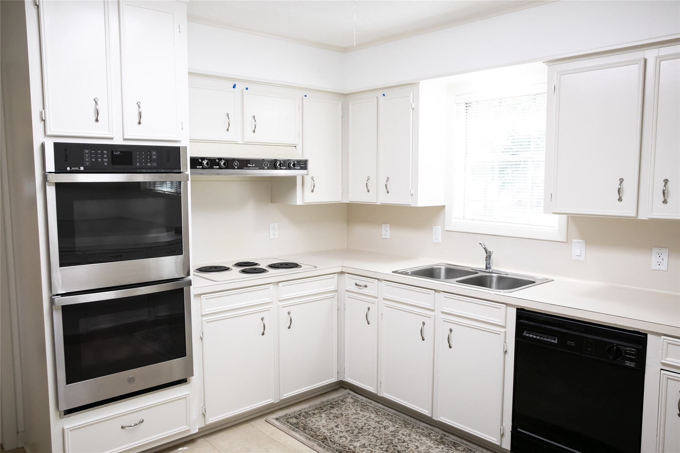 1600 Reimer Street Brenham, TX 77833 - Photo 14 of 24 a kitchen with cabinets appliances and a sink