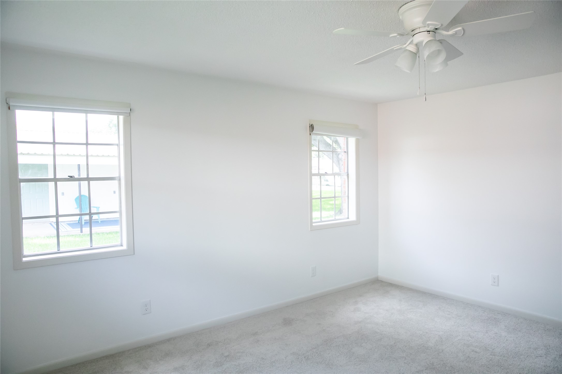 1600 Reimer Street Brenham, TX 77833 - Photo 22 of 24 an empty room with a window and a fan