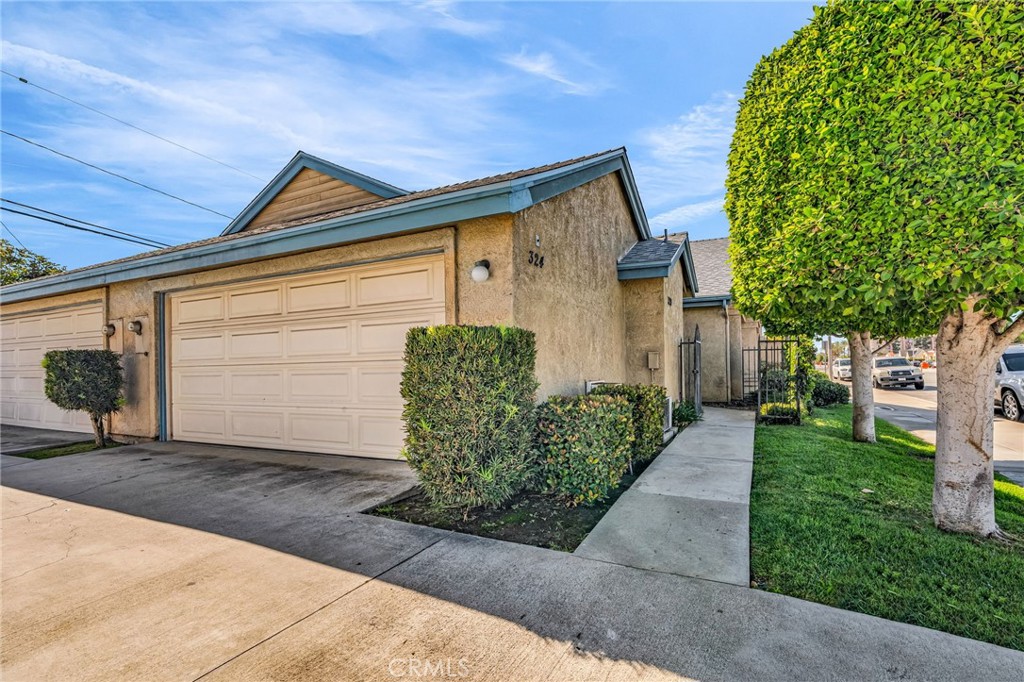 320 North Montebello Boulevard Montebello, CA 90640 - Photo 14 of 15 a front view of a house with garden