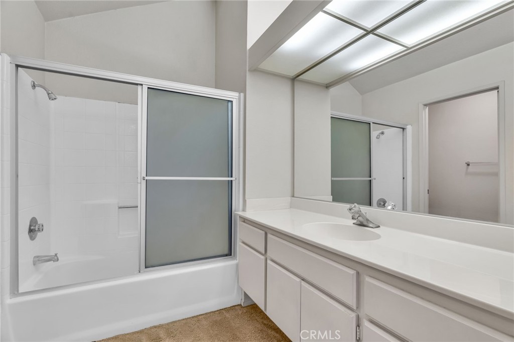 320 North Montebello Boulevard Montebello, CA 90640 - Photo 9 of 15 a bathroom with a double vanity sink and a bathtub