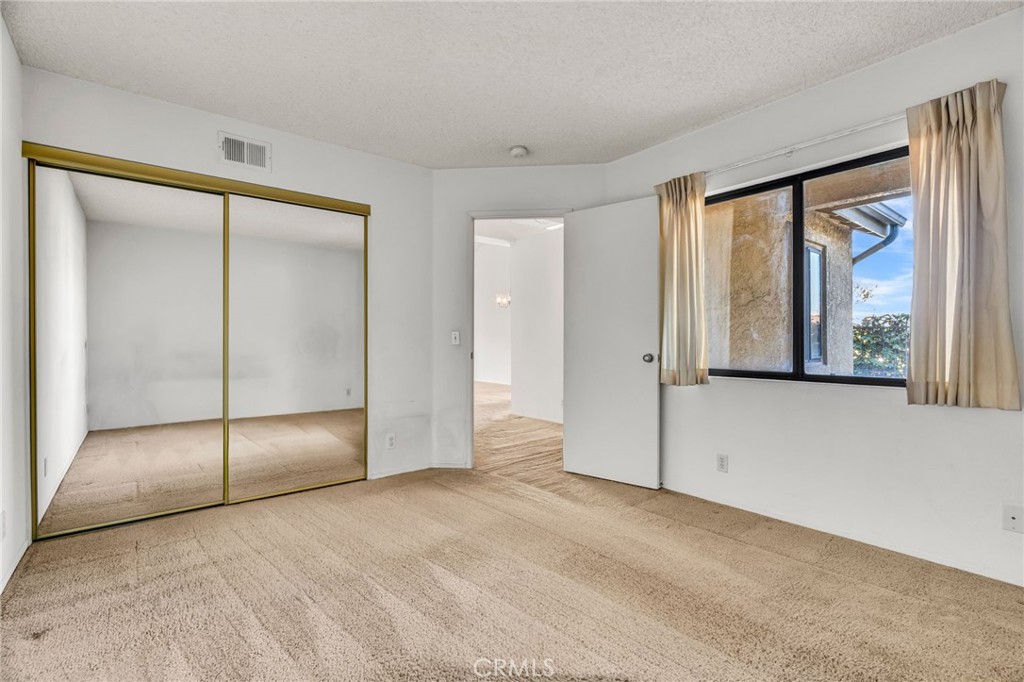 320 North Montebello Boulevard Montebello, CA 90640 - Photo 10 of 15 an empty room with windows and closet