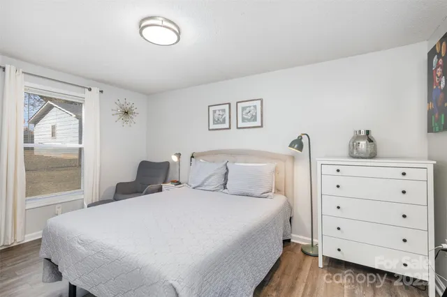 a large white bed in a white room