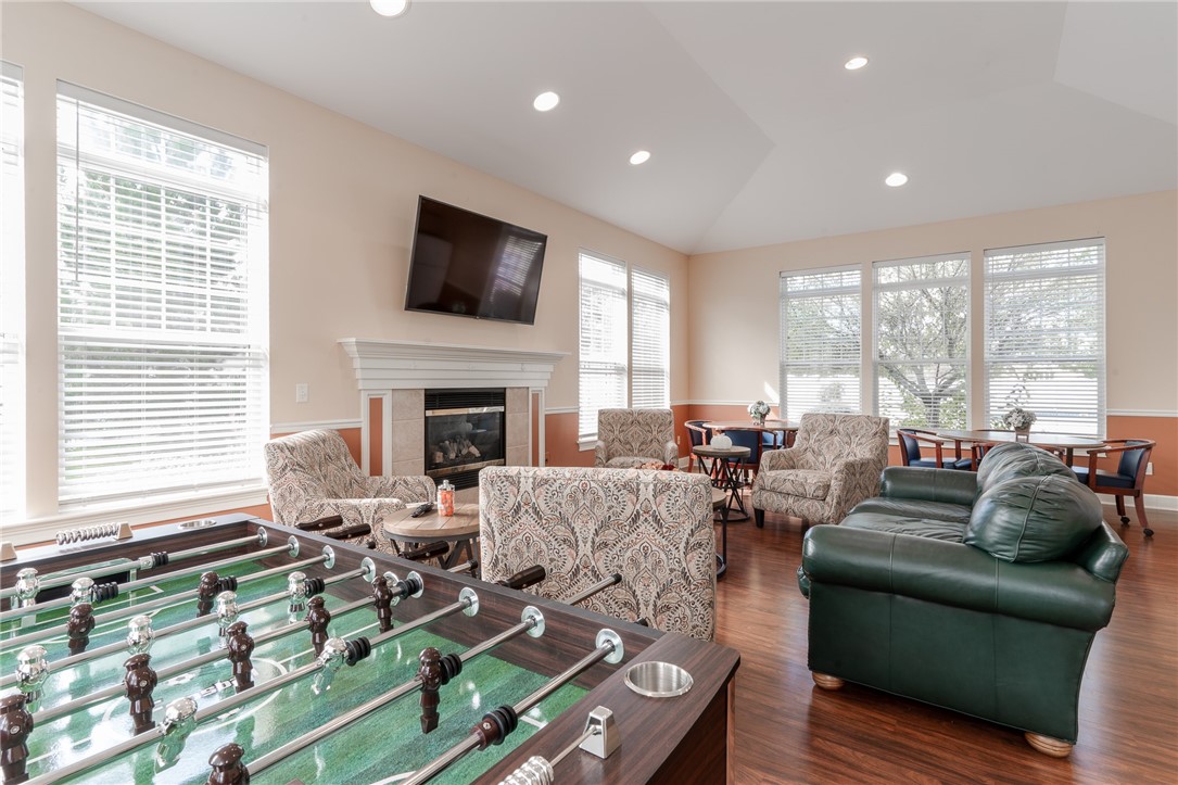 738 Royal Sunset Drive Webster, NY 14580 - Photo 15 of 15 Community Room with foosball, TV and kitchenette