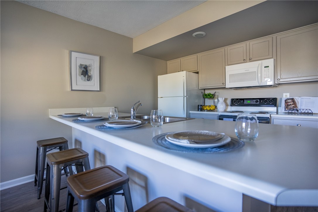 738 Royal Sunset Drive Webster, NY 14580 - Photo 4 of 15 View of typical kitchen in the open plan layout sh