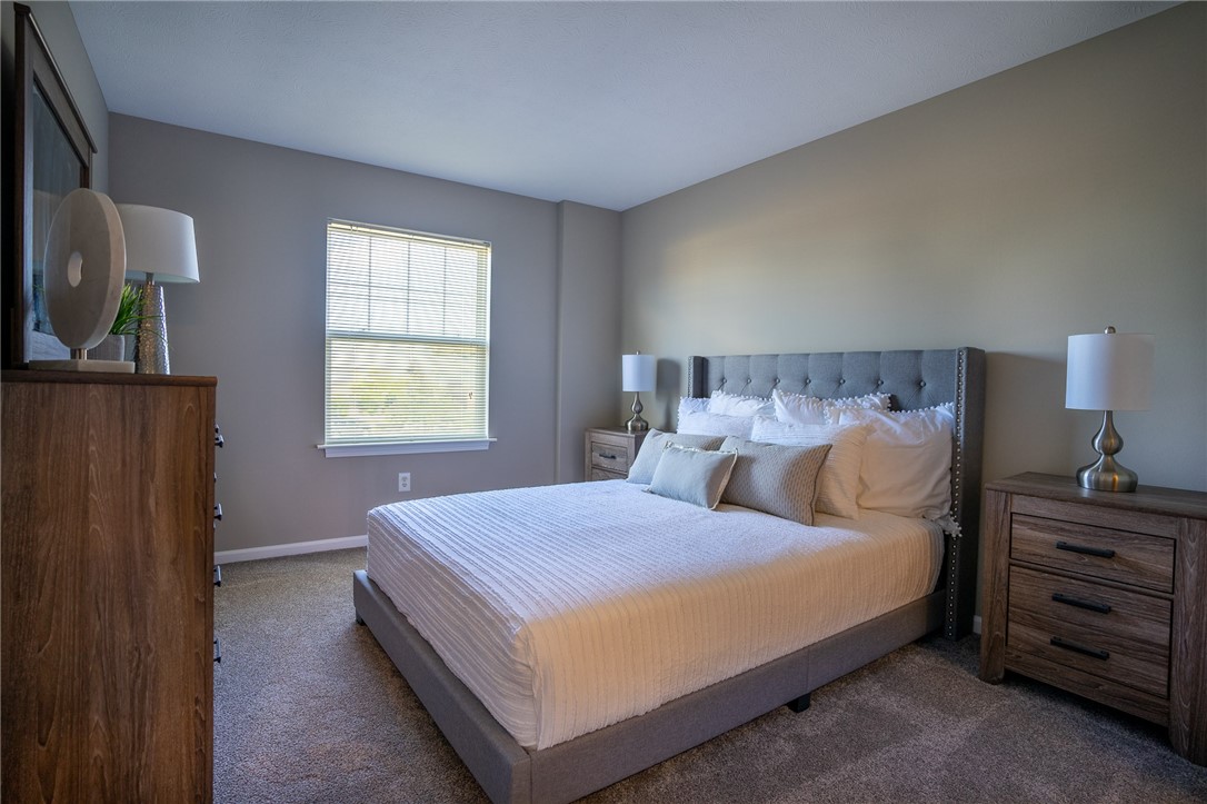 738 Royal Sunset Drive Webster, NY 14580 - Photo 7 of 15 Typical primary bedroom with wall-to-wall carpetin