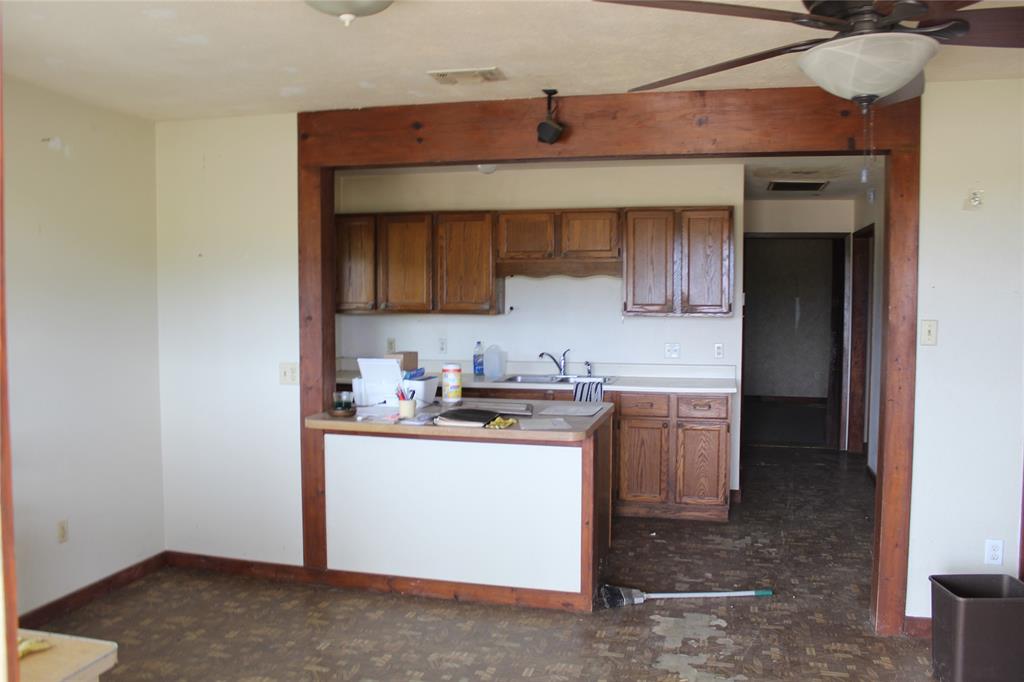 278 County Road 4460 Decatur, TX 76234 - Photo 19 of 19 a kitchen with stainless steel appliances granite countertop a sink stove and cabinets