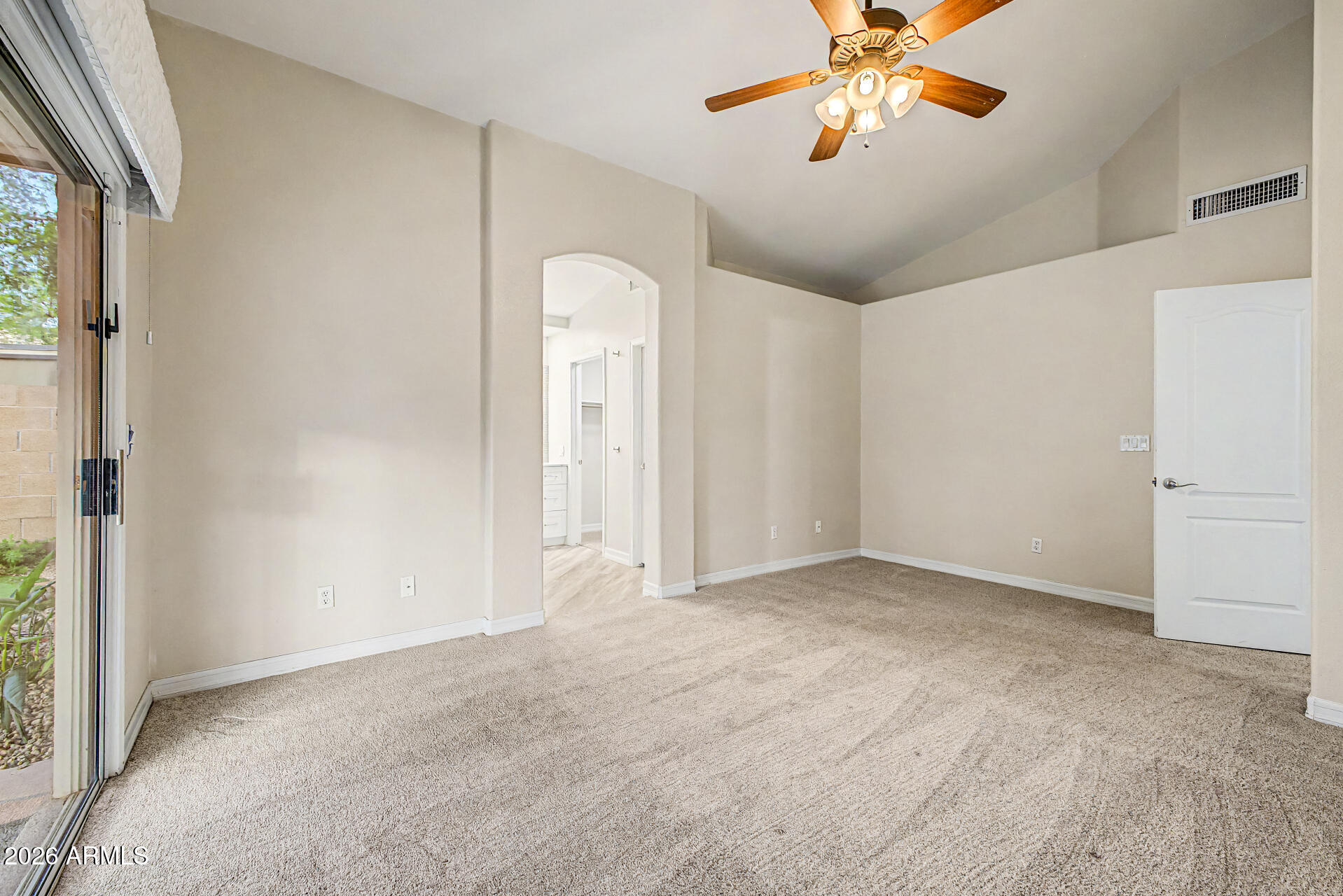 4102 East Rock Wren Road Phoenix, AZ 85044 - Photo 13 of 25 an empty room with chandelier fan and windows