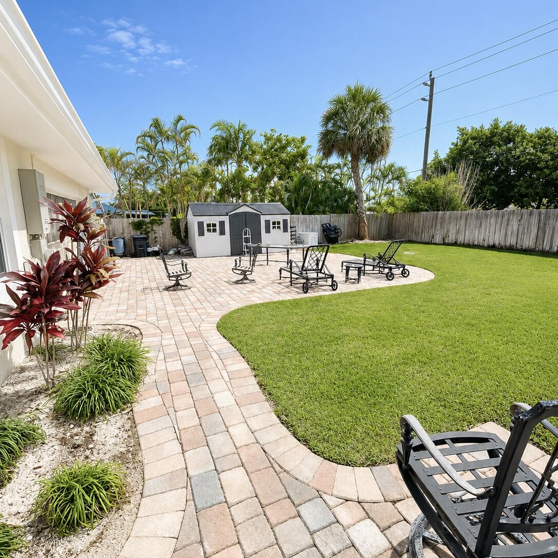1023 Northwest Spruce Ridge Drive Stuart, FL 34994 - Photo 30 of 33 Backyard and patio