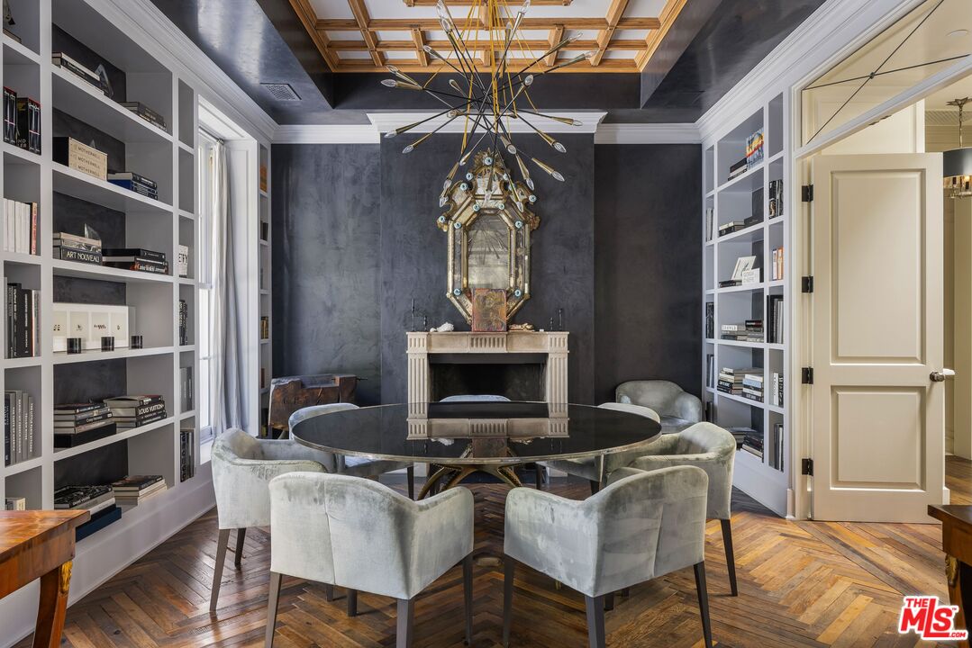 1701 Westridge Road Los Angeles, CA 90049 - Photo 11 of 36 a work room with furniture and a chandelier