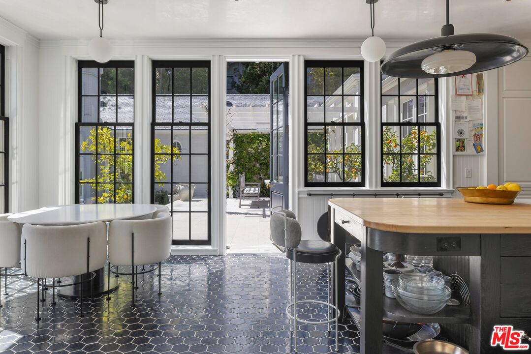 1701 Westridge Road Los Angeles, CA 90049 - Photo 16 of 36 a view of a dining room with furniture window and outside view
