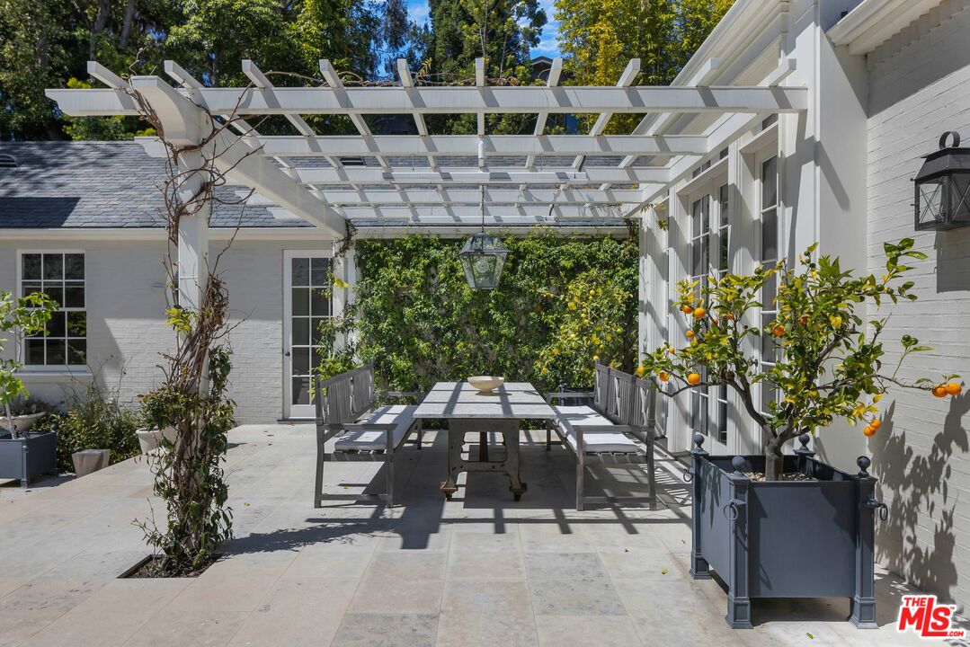 1701 Westridge Road Los Angeles, CA 90049 - Photo 22 of 36 a car parked in front of a building