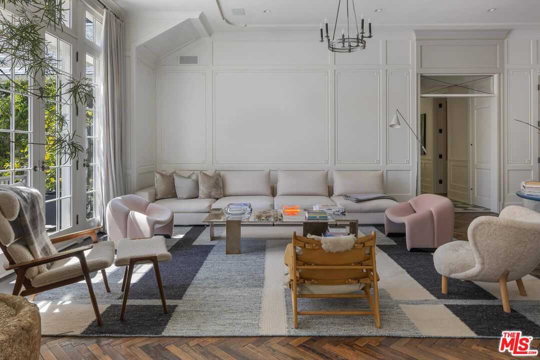 1701 Westridge Road Los Angeles, CA 90049 - Photo 10 of 36 a living room with patio furniture and a floor to ceiling window