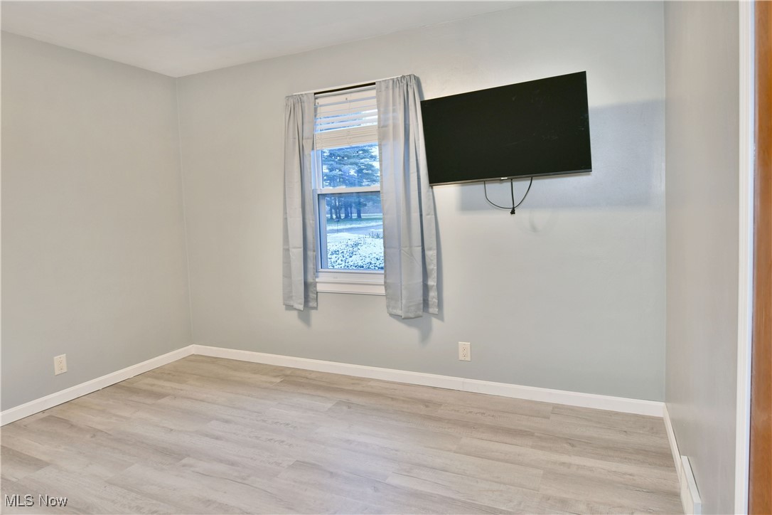 4335 Crew Hood Road Girard, OH 44420 - Photo 29 of 50 Empty room with light hardwood / wood-style flooring