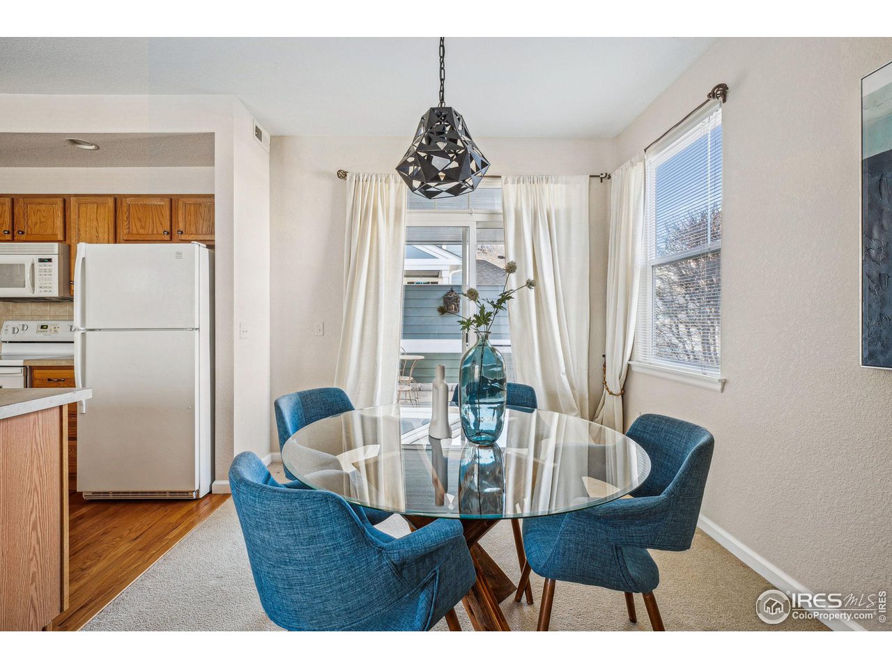 4501 Nelson Road, Unit 2303 Longmont, CO 80503 - Photo 12 of 36 Dining room and access to back covered patio