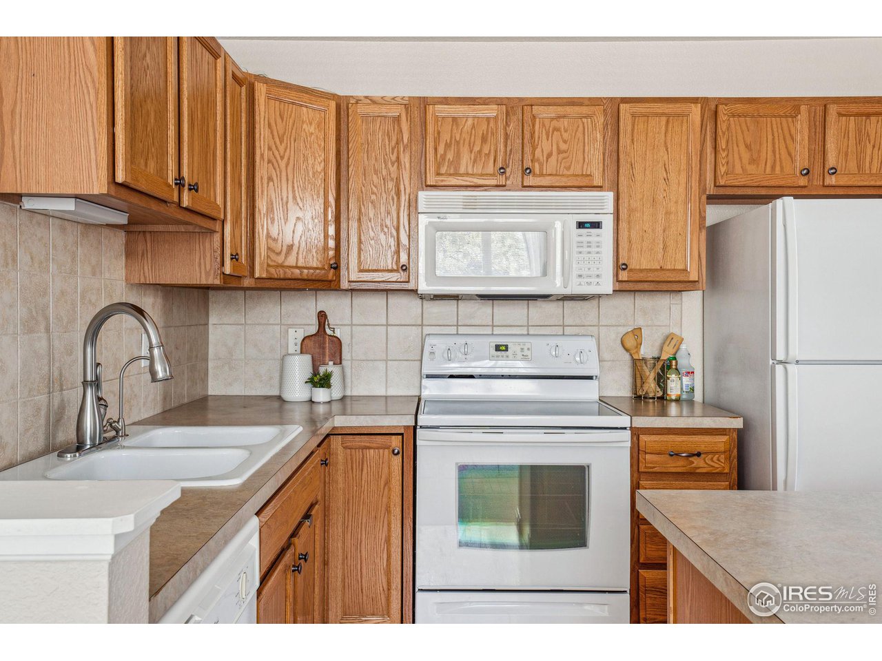 4501 Nelson Road, Unit 2303 Longmont, CO 80503 - Photo 15 of 36 Kitchen with abundant cabinets and counterspace