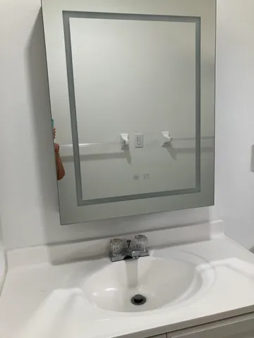 a bathroom with a toilet a sink and a shower