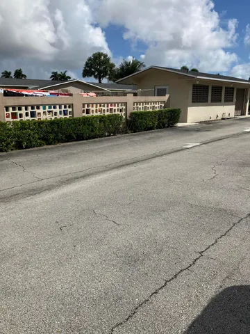 a view of a swimming pool and front of house