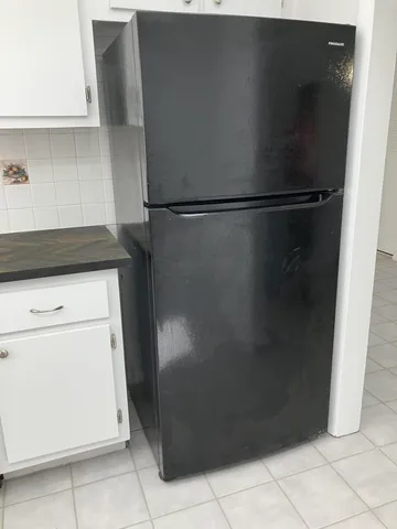 a kitchen with granite countertop a sink stainless steel appliances and cabinets