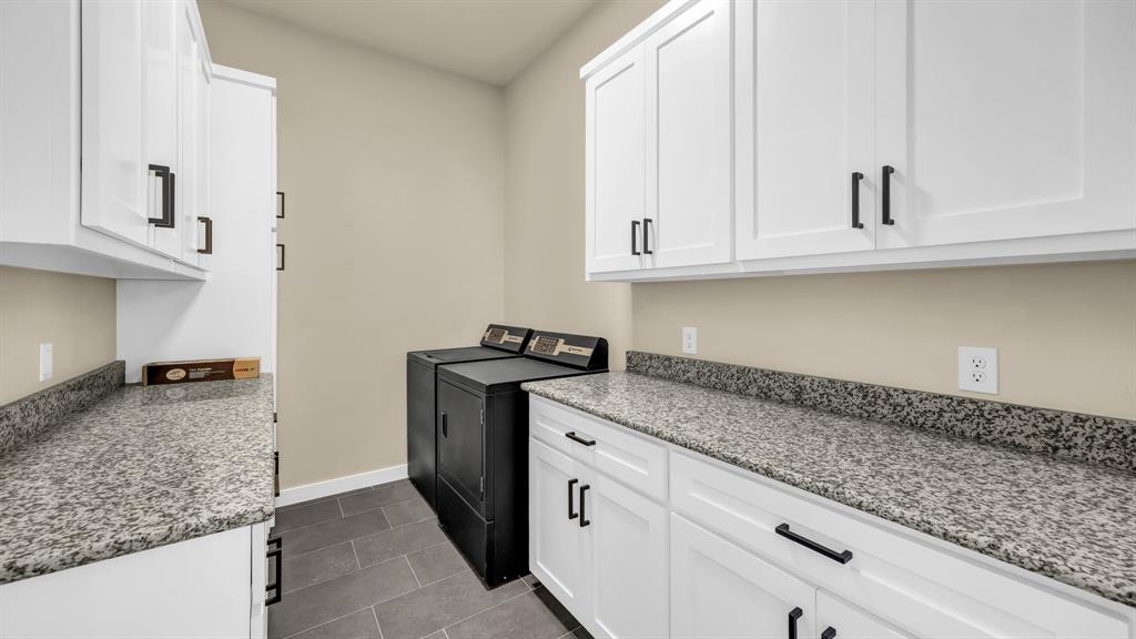 3 Quarter Loop Poolville, TX 76487 - Photo 20 of 40 a kitchen with granite countertop a sink and a stove