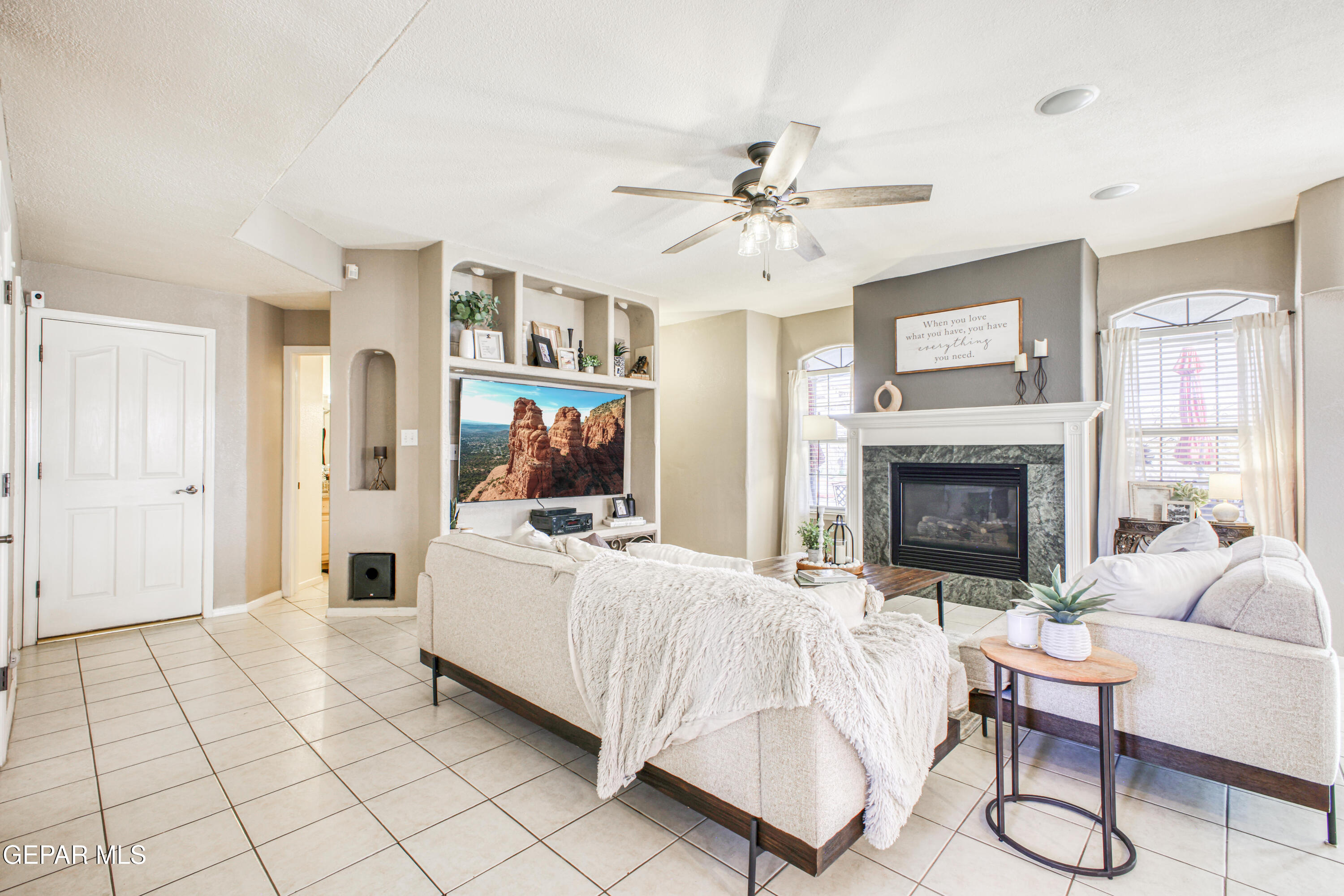 1420 Cloud Ridge Drive El Paso, TX 79912 - Photo 18 of 77 a living room with furniture and a fireplace