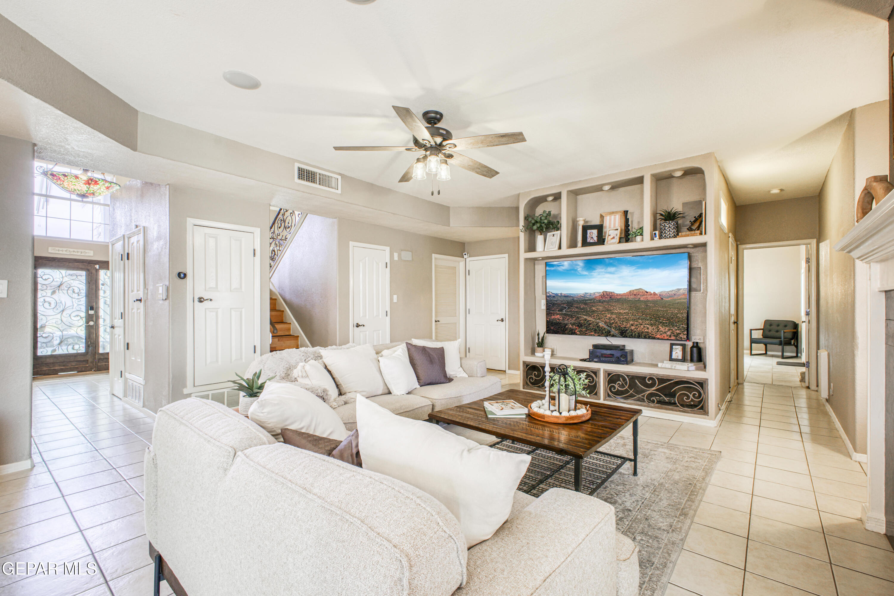 1420 Cloud Ridge Drive El Paso, TX 79912 - Photo 19 of 77 a living room with furniture a dining table and a fireplace