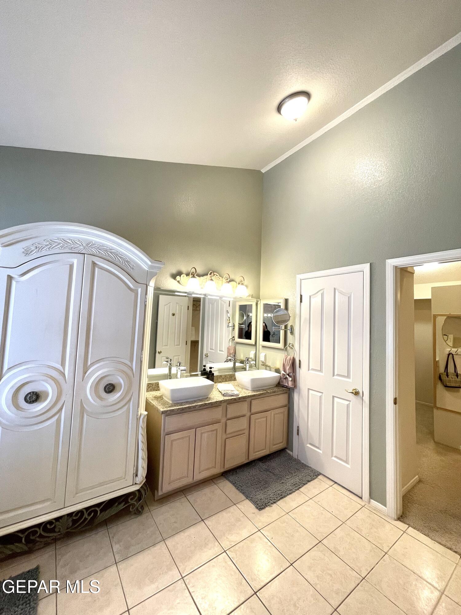 1420 Cloud Ridge Drive El Paso, TX 79912 - Photo 42 of 77 a kitchen with a sink and refrigerator
