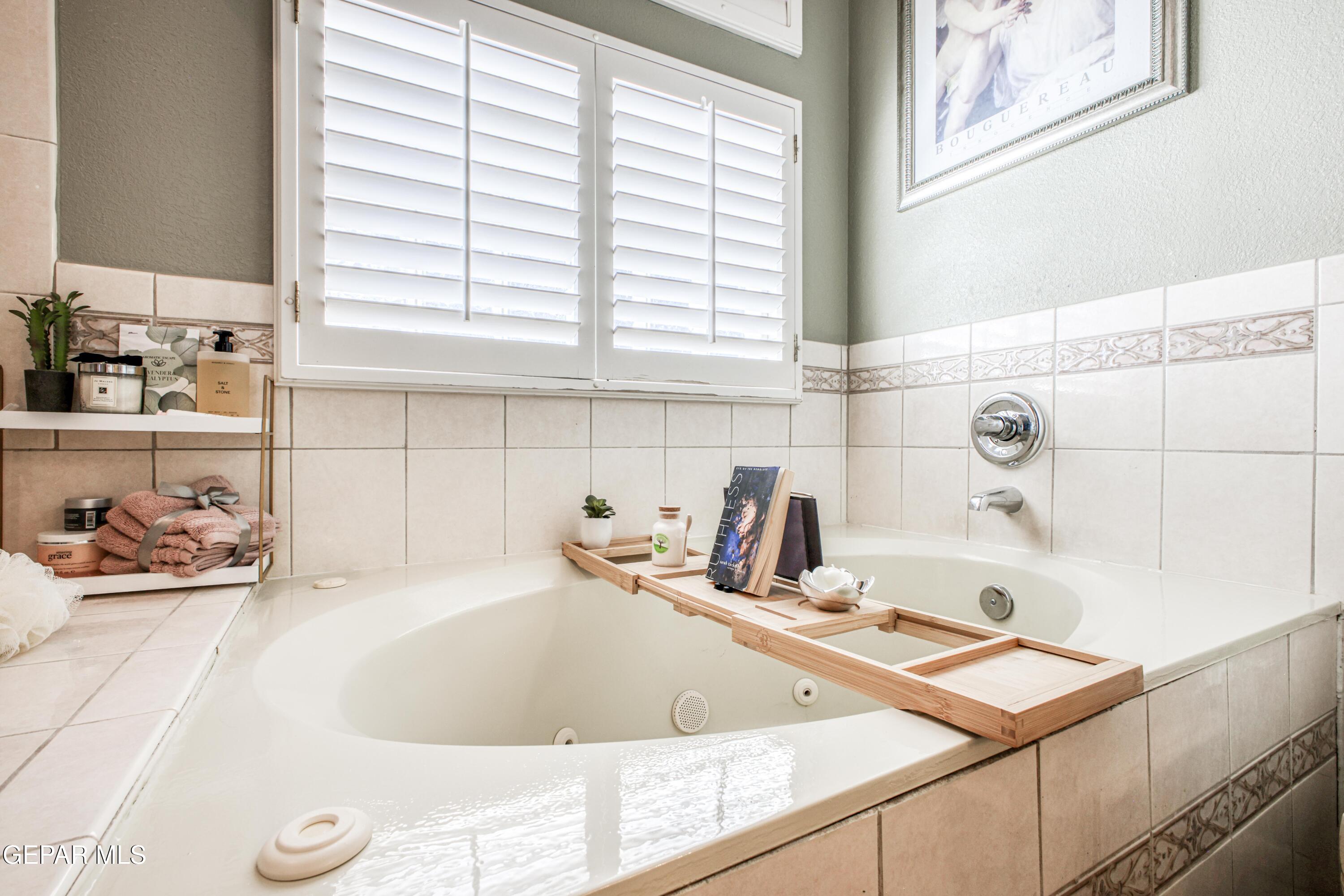 1420 Cloud Ridge Drive El Paso, TX 79912 - Photo 43 of 77 a bathroom with a tub and sink