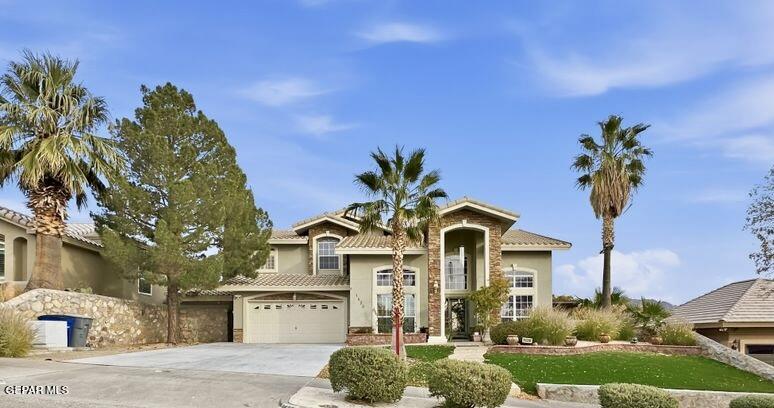 1420 Cloud Ridge Drive El Paso, TX 79912 - Photo 75 of 77 a front view of a house with a yard