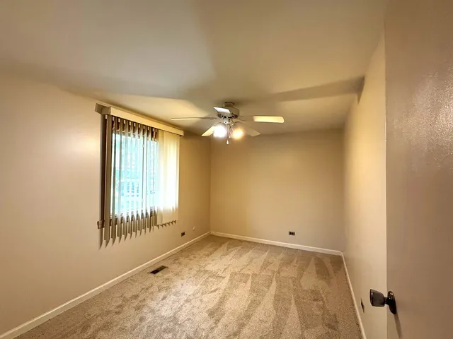 a view of a lake with houses in the back