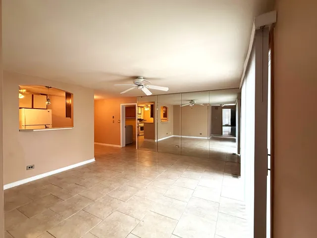 an empty room with a empty space and windows