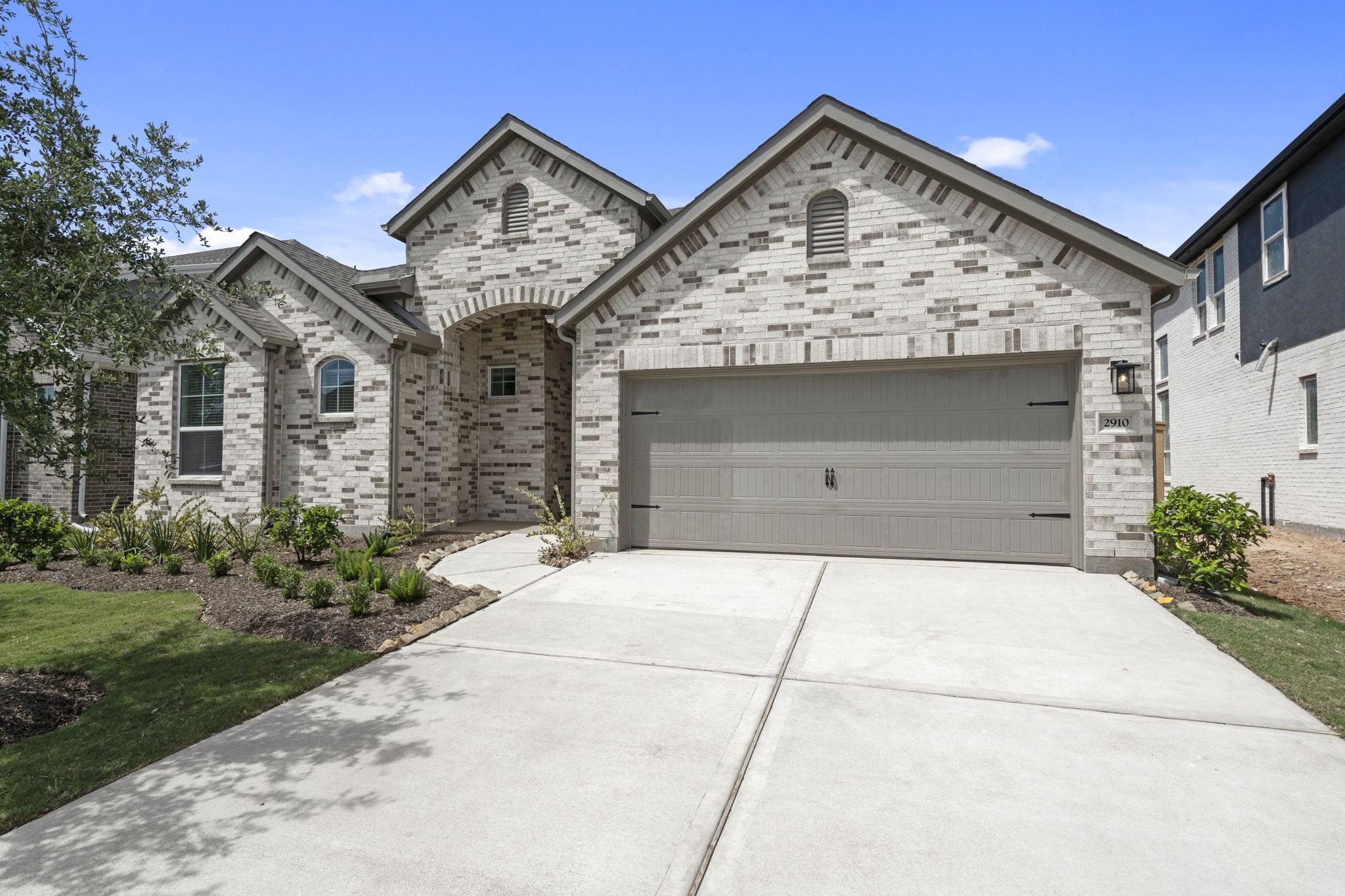 2910 Peach Vly Road Fulshear, TX 77423 - Photo 4 of 35 a front view of a house with garden