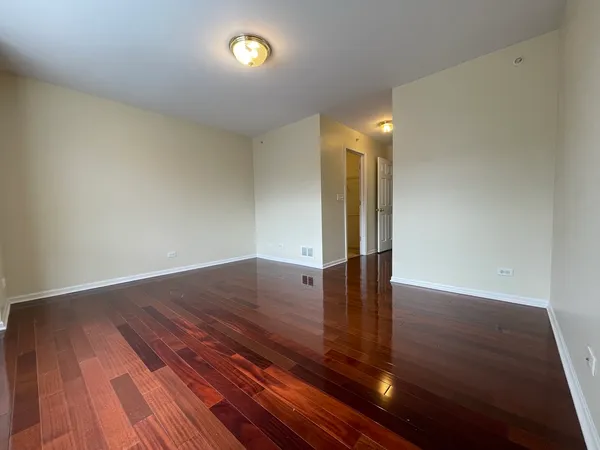 a view of hallway with wooden floor