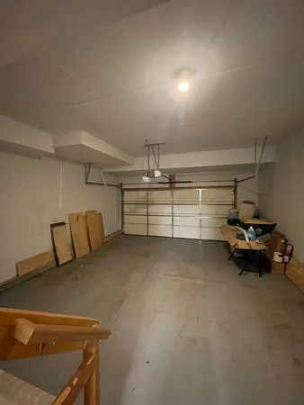 a view of a room with lots of white furniture